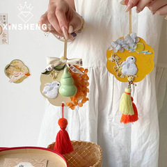 心の中の中秋の新商品の月の半団扇は花の花束を掛けて花の芸を飾って贈り物の贈り物を飾ります。