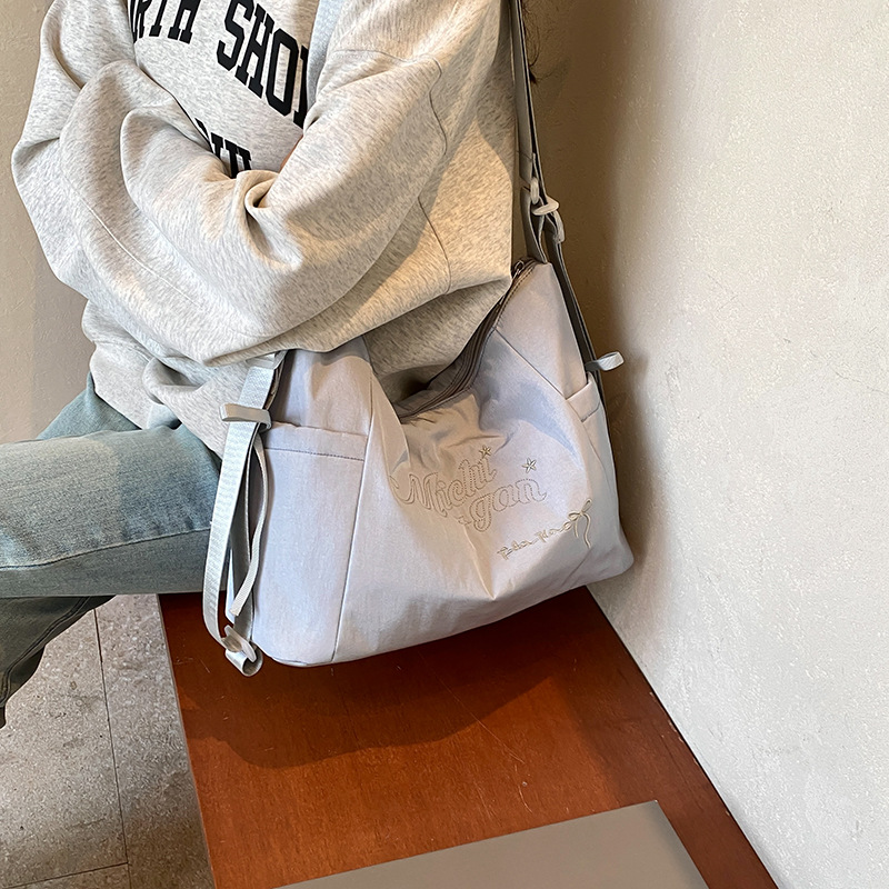 Bolsa de lienzo de letras de la escuela de verano 2024 nueva moda coreana nicho bolso tote de gran capacidad mochila