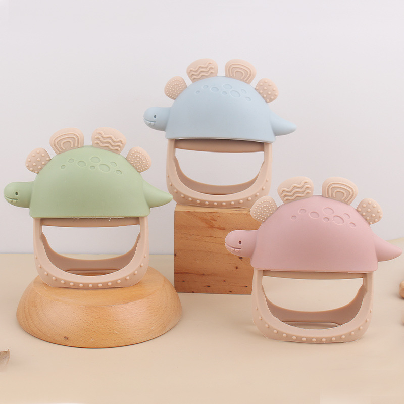 Nuevos guantes de mordedor de dinosaurio de silicona anti-comer para bebés