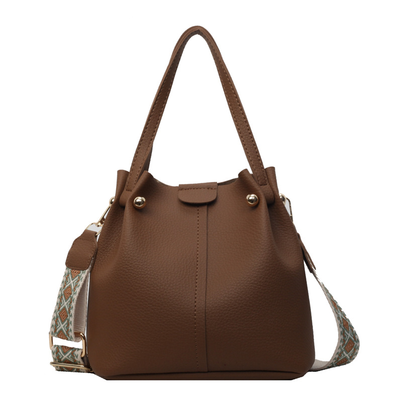 Mayorista retro bolso de cubo portátil para mujeres ventas calientes nuevo retro gran capacidad bolso de hombro simple mochila de viaje