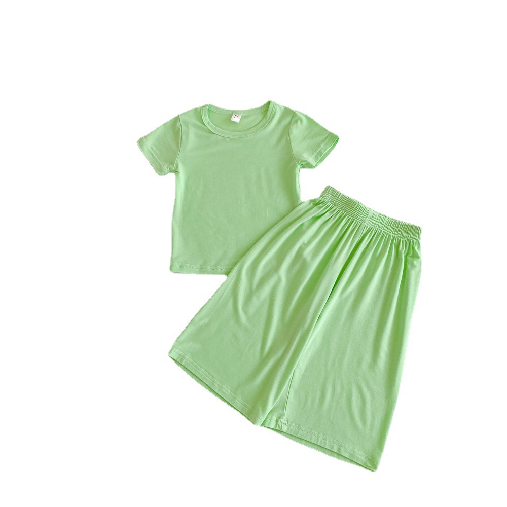 Corea del Sur ropa para niños al por mayor 2024 primavera y verano de los niños delgados color sólido desgaste del hogar traje bebé camiseta 7 pantalones dos piezas