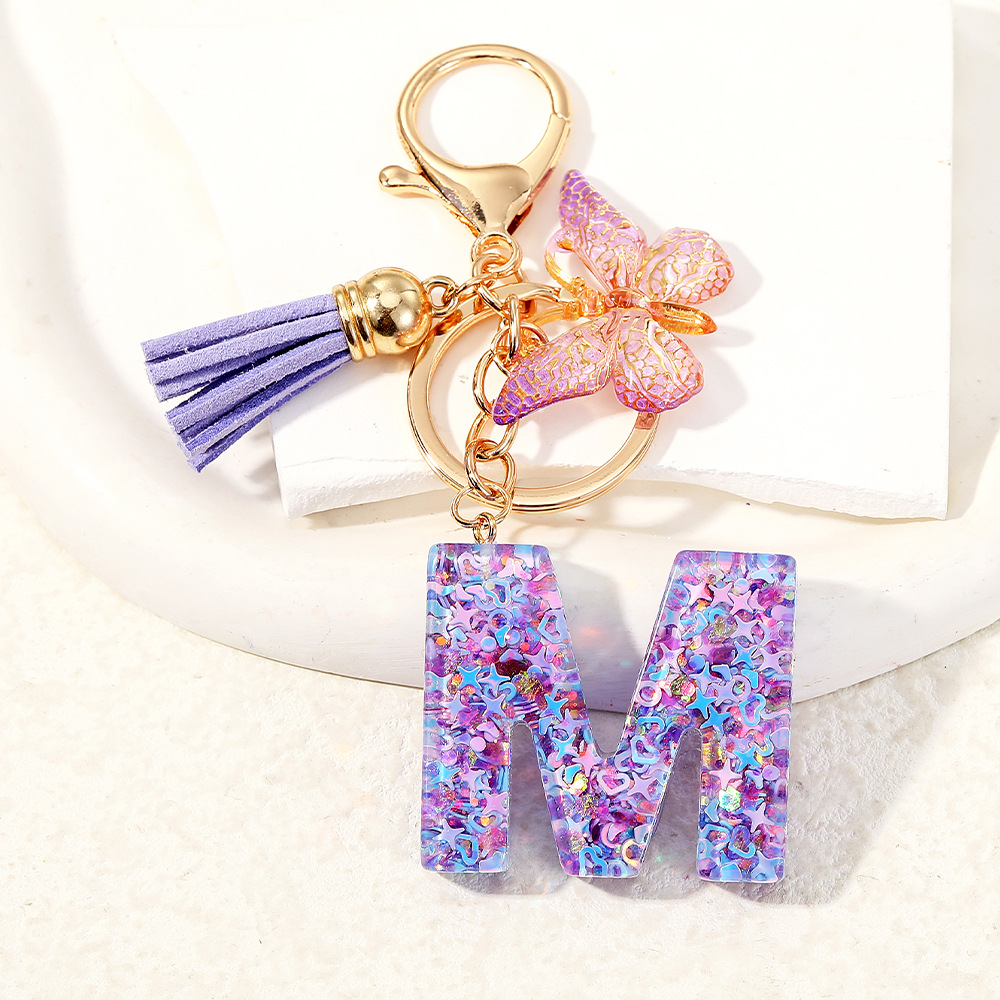 Mayorista transfronterizo mariposa esquinilla iniciales llavero de cristal goteo llavero de letras bolsos colgante