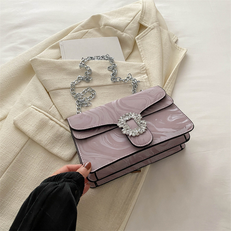 Moda simple temperamento coreano cadena de hombro bolso de mochila para mujeres 2024 primavera nueva bolsa de diamantes de estilo extranjero