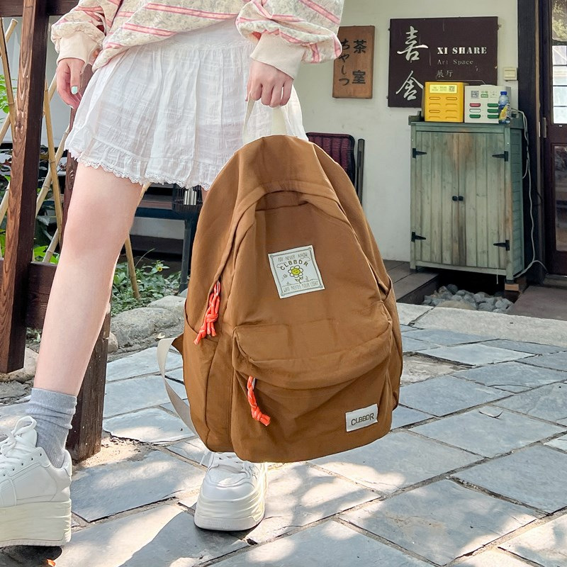 2024 otoño nuevo estilo ins versión coreana de la mochila de la escuela secundaria de gran capacidad estilo japonés contraste color sólido mochila doble al por mayor