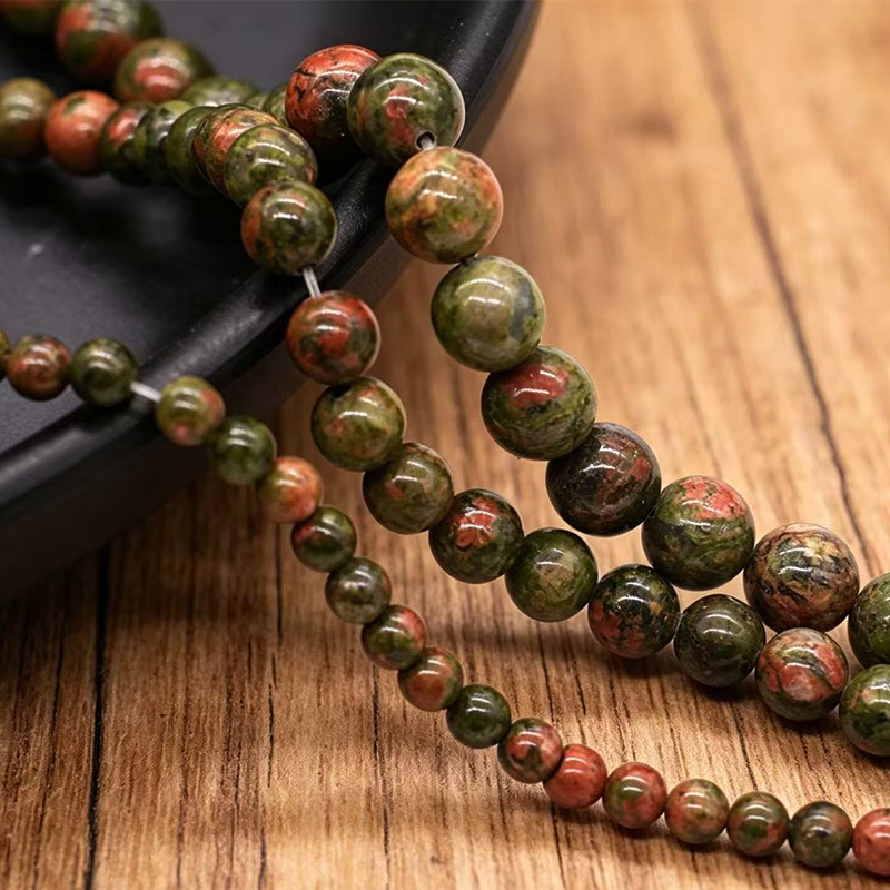 Los fabricantes suministran directamente collares de pulsera de cuentas dispersas de cuentas redondas de esmeralda natural DIY joyas semiacabadas al por mayor
