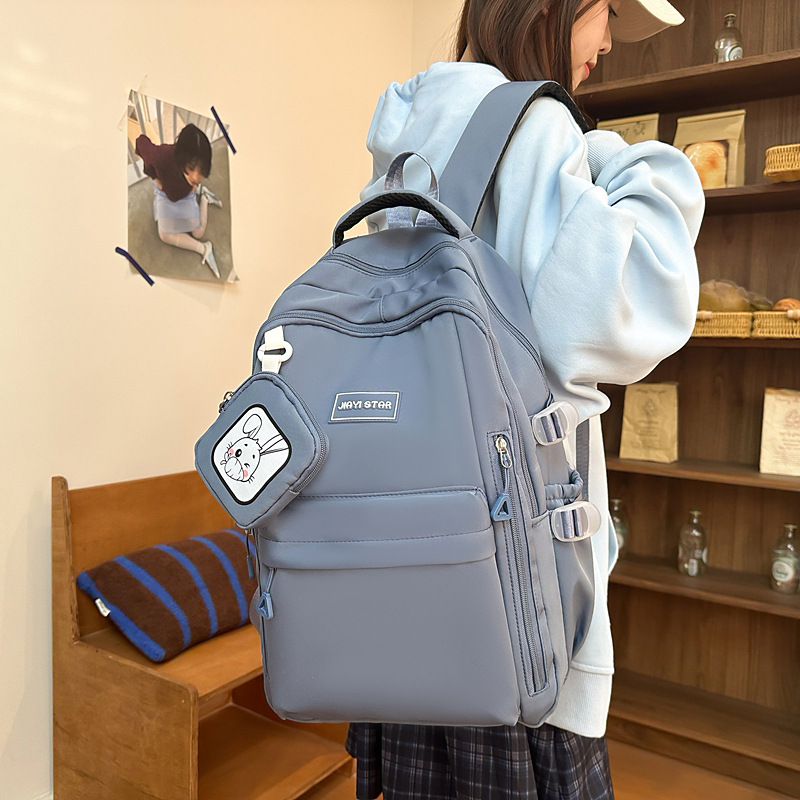 Mochila de estudiantes de moda simple 2025 nueva mochila casual de color sólido mochila de viaje de gran capacidad soporte personalizado