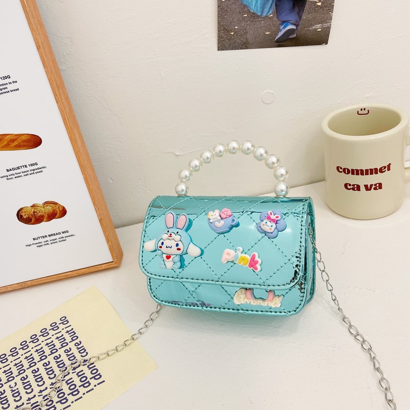 Bolso infantil 2024 nuevo estilo coreano de cadena de dibujos animados bolso de hombro estilo Xiaoxiang Ling mochila para hombres y mujeres bolsos pequeños