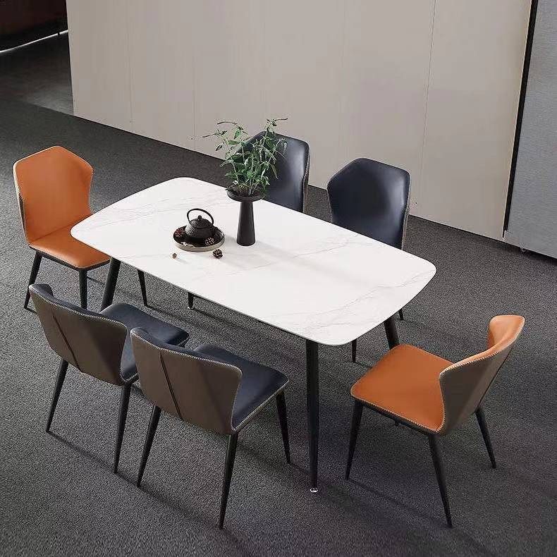 Mesa y silla de comedor de tabla de roca ligera de estilo italiano de lujo, combinación de mesa y silla de comedor de apartamento rectangular moderno y simple.