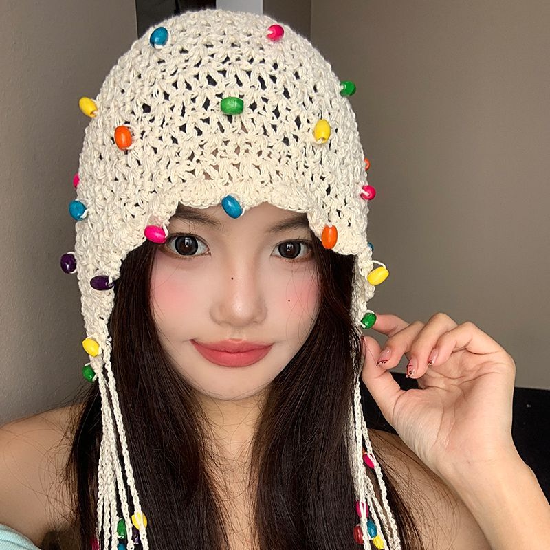 女性用の春夏の手織り中空つば帽子、エスニックスタイルのフックフラワー、タッセルストラップ、プルオーバーニット帽、多用途|undefined