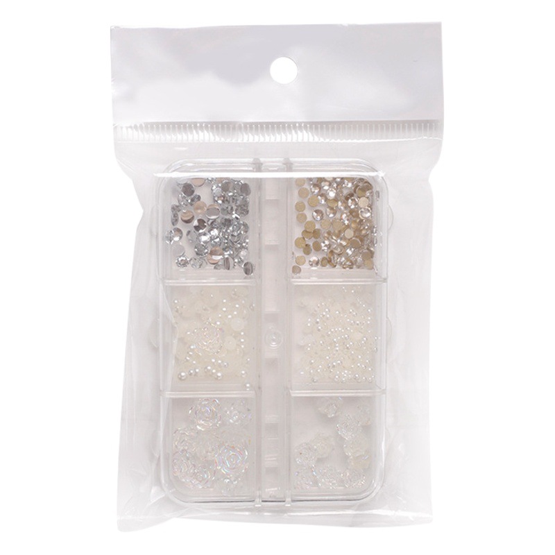 Joyería de uñas Aurora arco perla remache pequeños accesorios Super Flash pequeño diamante 12 rejilla mixta decoración de uñas al por mayor