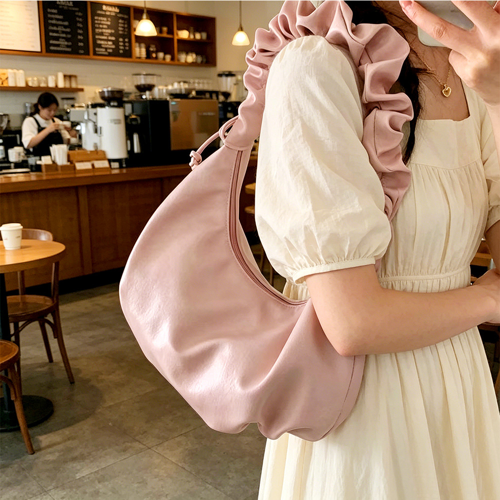 2026 nuevo estilo de mujer bolso de estilo extranjero bolso de moda alta sensación de nube bolso de hombro viento dulce simple plegado