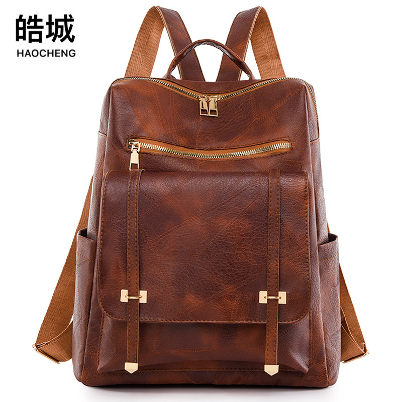 Amazon al por mayor verano nuevo estilo retro damas cuero suave mochila simple y versátil mochila portátil de gran capacidad