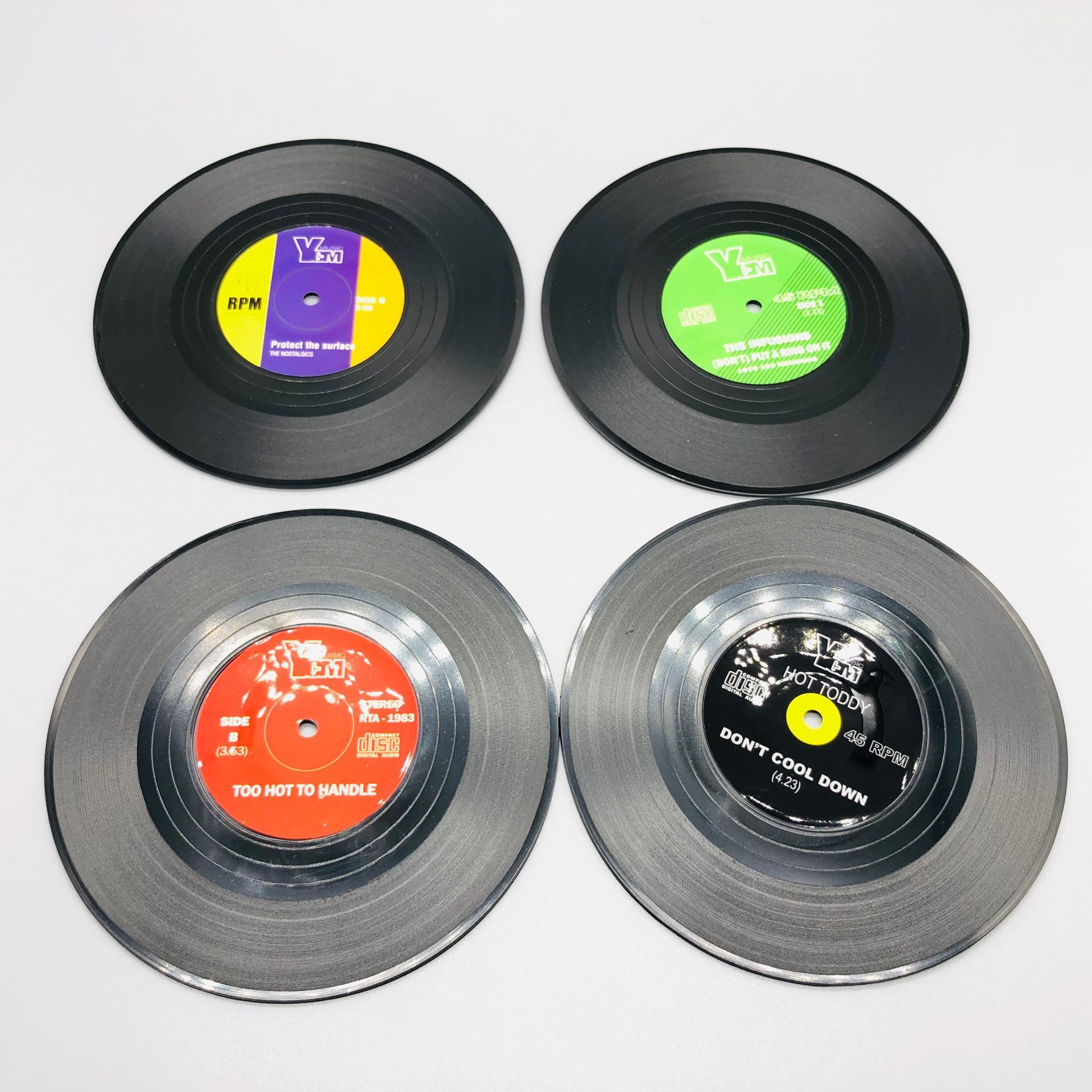 Venta caliente retro CD Coaster disco de vinilo cerveza bar estera de café de plástico taza de té estera productos transfronterizos ventas directas de la fábrica