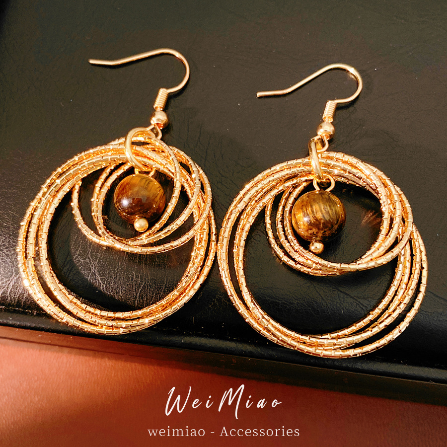 Medieval vintage ojo de tigre redondo hueco gancho de orejas temperamento temperamento temperamento aretes ligeros lujosos de alto nivel sensación de orejas