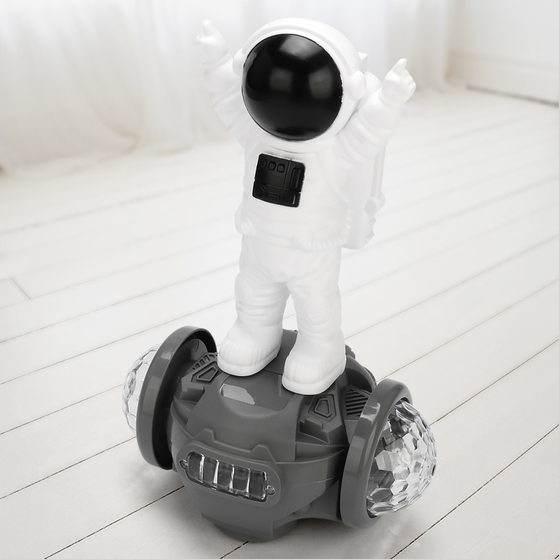 Vehículo de equilibrio de astronauta universal eléctrico para niños, luz de música colorida, carro de juguete para niños al por mayor