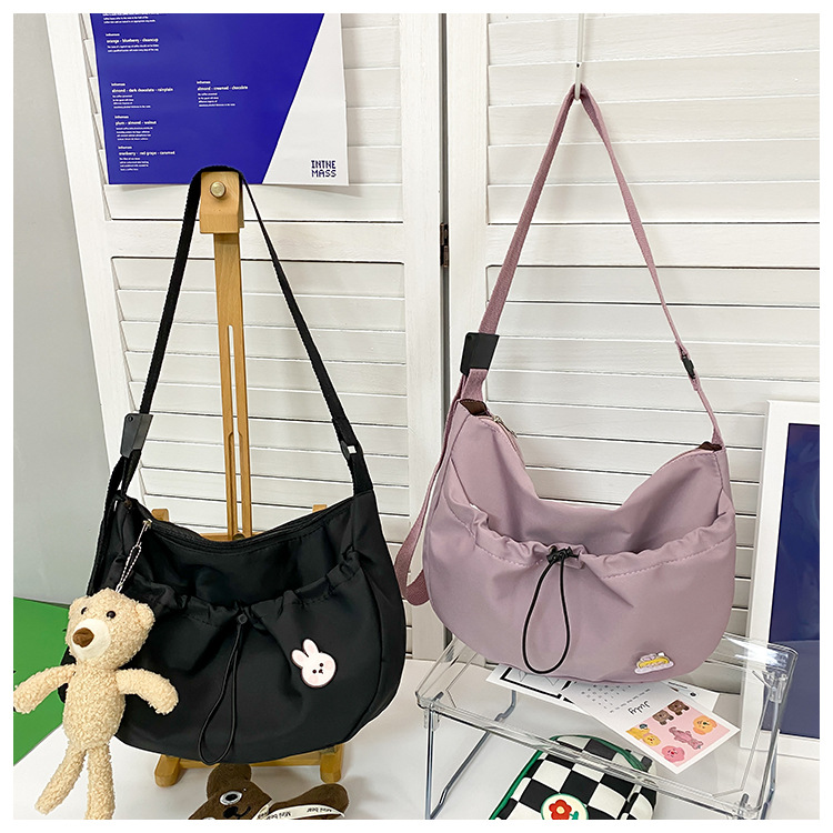 The new 2022 Little Bear canvas small bag for women is simple and versatile. The student dumpling bag is a trendy casual single-shoulder crossbody bag undefined