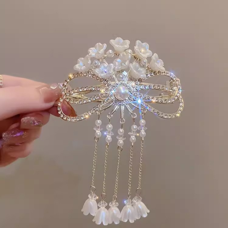 스즈키 난초 술 트위스트 클립 2023 새로운 백 헤드 디스크 머리핀 고급 감각 헤어 액세서리 한 글자 클립 모자 여성