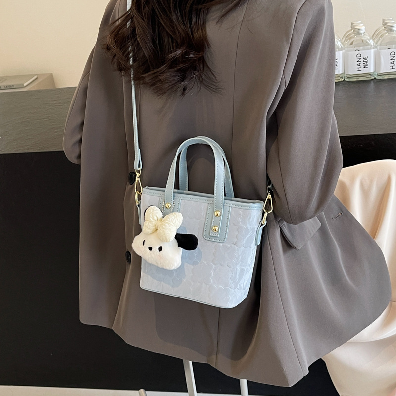Bolsa de cubo de mano de moda coreana para mujeres primavera y verano 2024 nuevo nicho casual de moda universal mochila de hombro