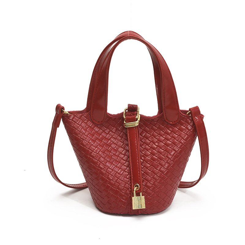 Bolso de cubo portátil con patrón tejido para mujer 2025 nuevo estilo coreano de lujo ligero de alta gama bolso de mensajero para niños de nicho