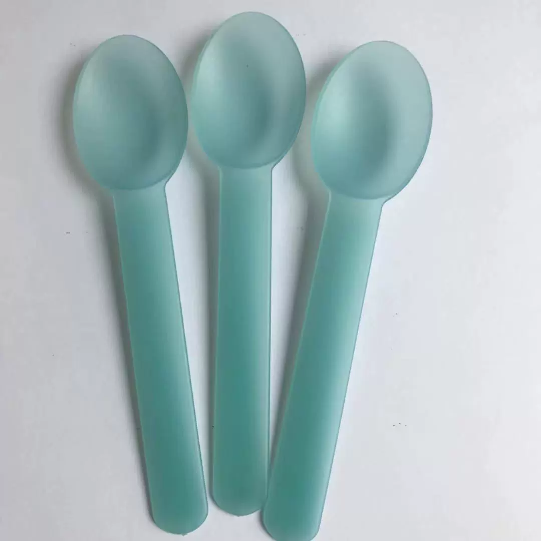 Green purple spoon for ice cream