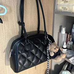 高級感のあるワッフルのボストンバッグ女性2025の新型通勤用シングルバッグのシンプルなハンドバッグ
