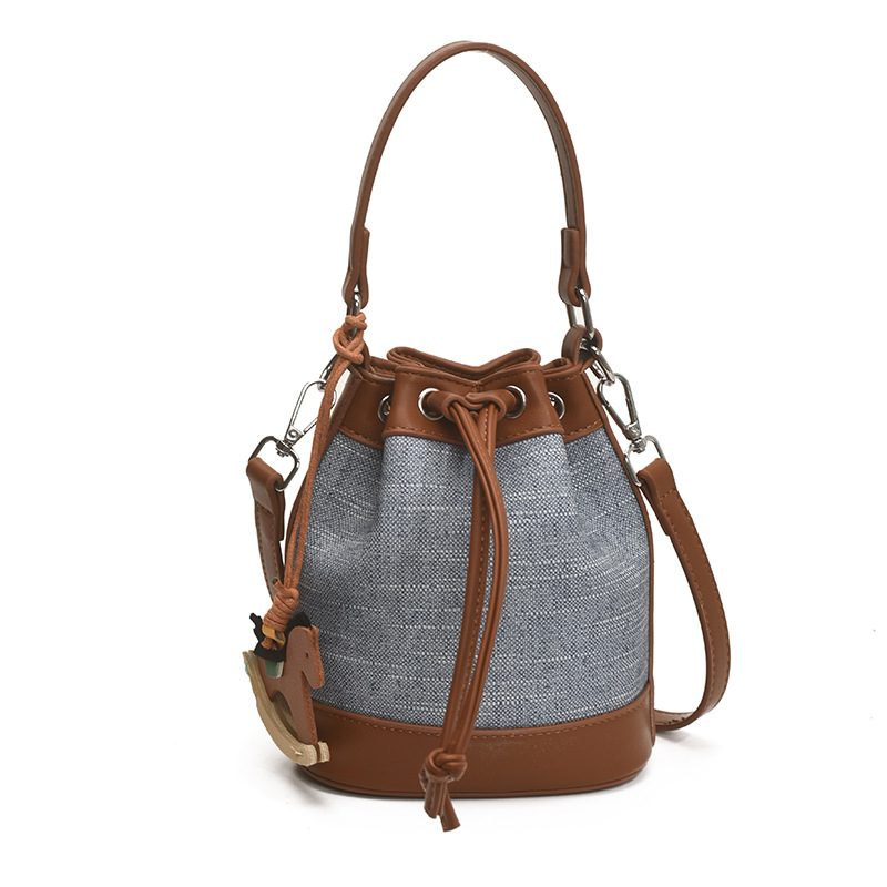 Bolso de cubo de moda transfronteriza 2025 nuevo bolso de hombro de nicho con cordón bolso diagonal bolso de alta gama mujer