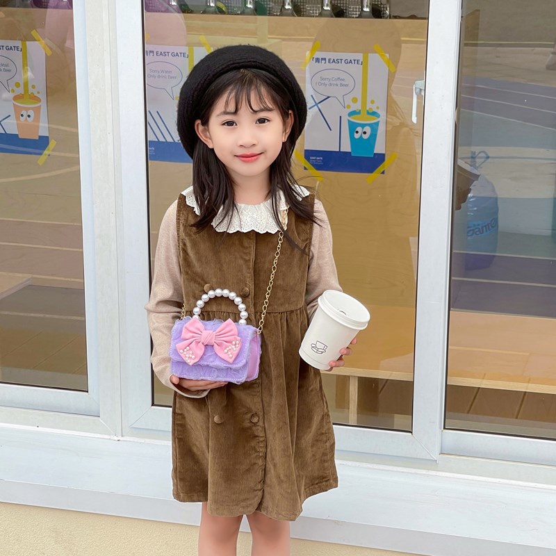 Dulce princesa bolso de hombro de perlas de aire extranjero bolso de mano para niños 2025 mini bolso de arco para niños