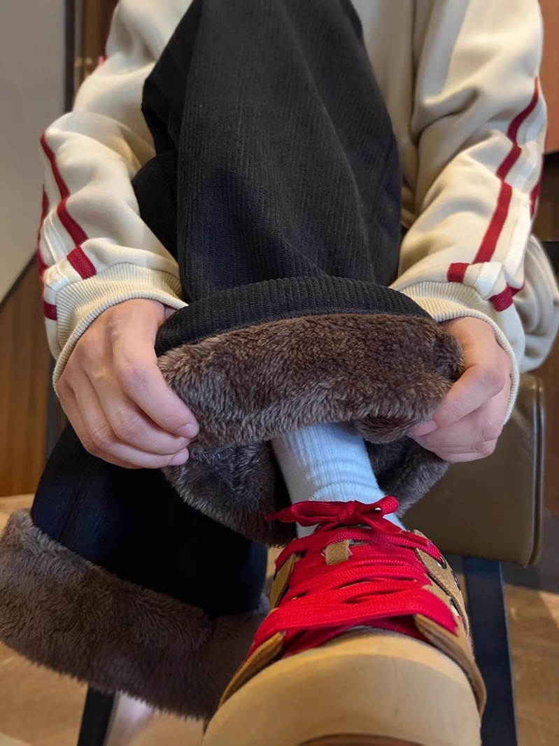 耐寒性零下40度のズボンの男性は冬に羊の小毛をつけます。