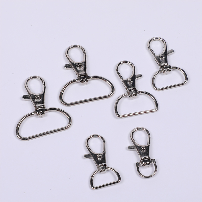 Suministro de metal en stock D-tail Boquilla de pescado de aleación de aluminio DiDi Joyas de proceso llavero gancho giratorio