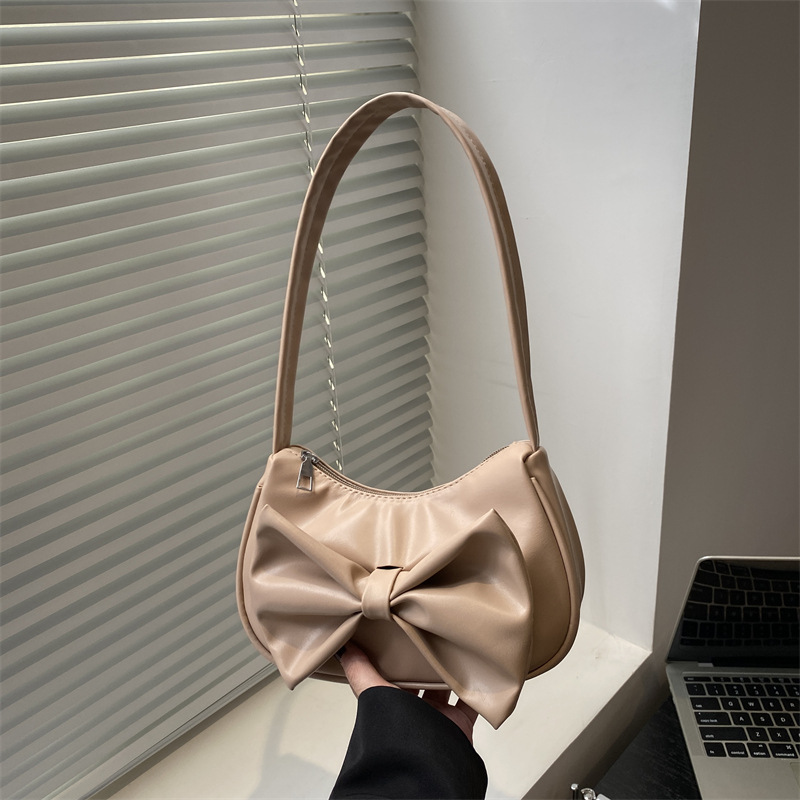 Bolso de axila con lazo de moda 2025 verano nuevo producto moda simple viajero estilo explosivo transfronterizo todo fósforo bolso femenino de un solo hombro