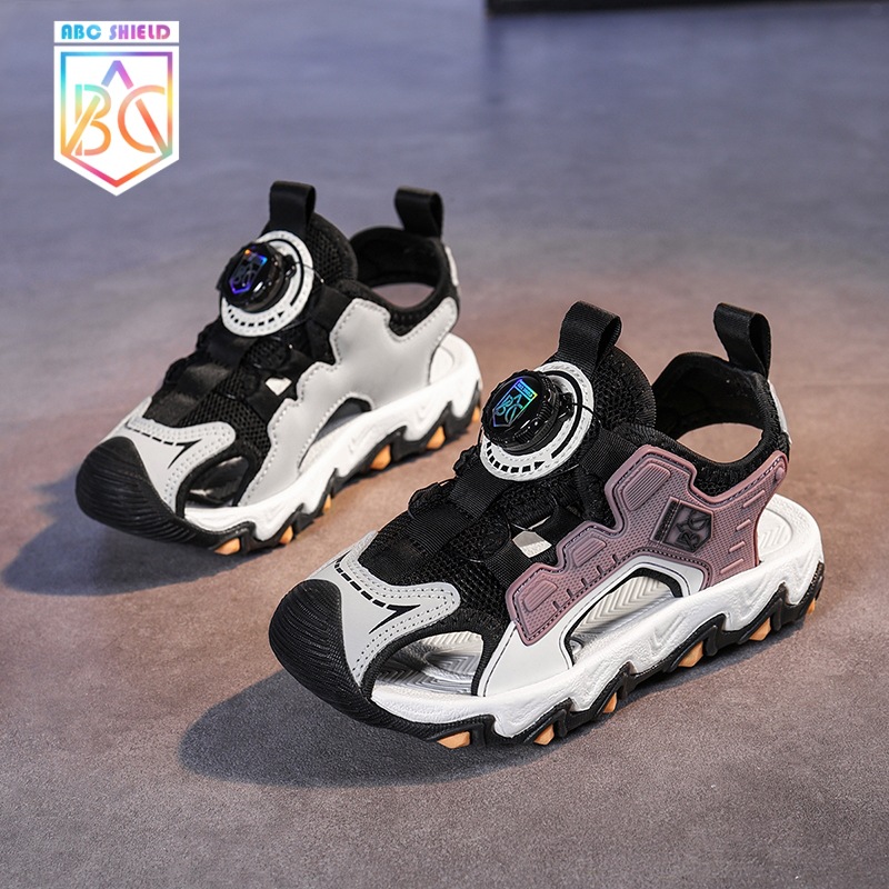 Sandalias para niñas Verano 2025 Sandalias antideslizantes de malla para niños Zapatos de playa Baotou Botón giratorio Sandalias para niños