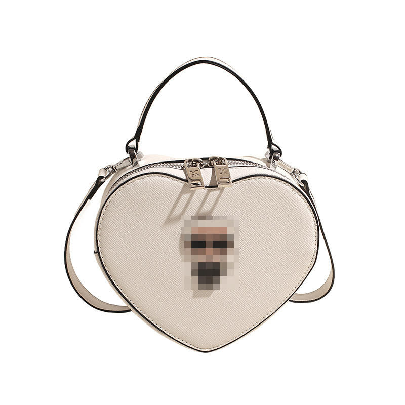 Bolsos transfronterizos para mujer 2024 nuevo bolso de hombro con diseño de corazón de nicho de moda bolso de mensajero portátil de amor de alta gama
