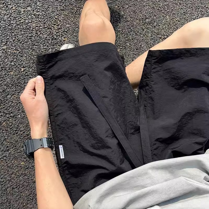 Pantalones cortos deportivos de secado rápido rosa dopamina para hombres 2025 nuevos pantalones de verano de talla grande pantalones sueltos casuales de cinco puntos