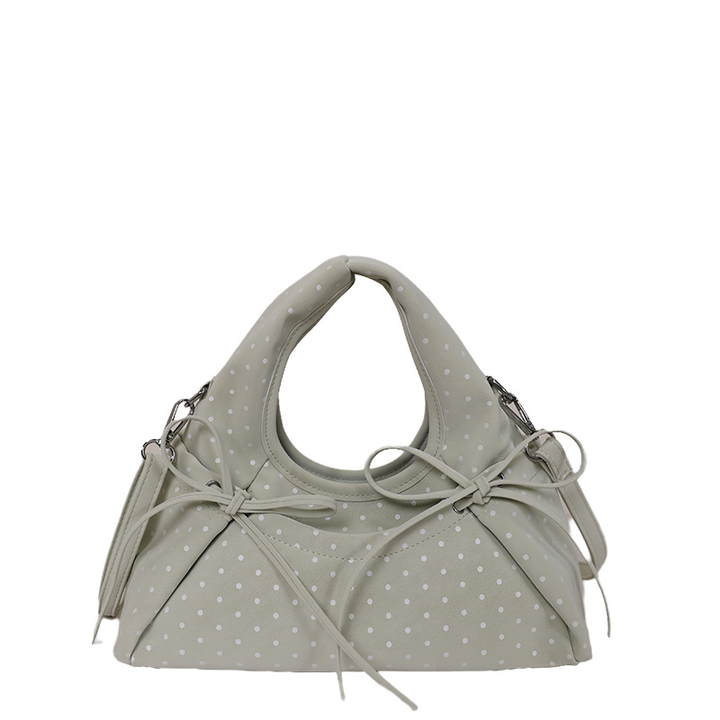 Bolsa de mano de arco exquisita coreana para mujeres verano 2026 simple diaria versátil onda punto sensación de hombro mochila