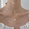 Necklace with bow from pearl, sophisticated pendant with tassels, fashionable chain for key bag , simple and elegant design