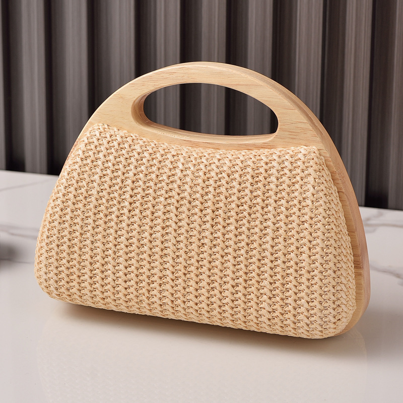 2025 nuevo bolso de mujer con clip de madera maciza tejido de paja bolso de verano de vacaciones junto al mar pequeño bolso de mujer fresco venta caliente transfronteriza