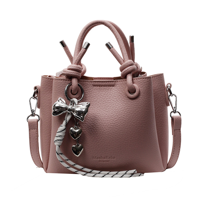 Bolso de mano de estilo explosivo de comercio exterior para mujer 2025 nuevo bolso de hombro casual simple bolso de cubo de sentido avanzado de moda salvaje