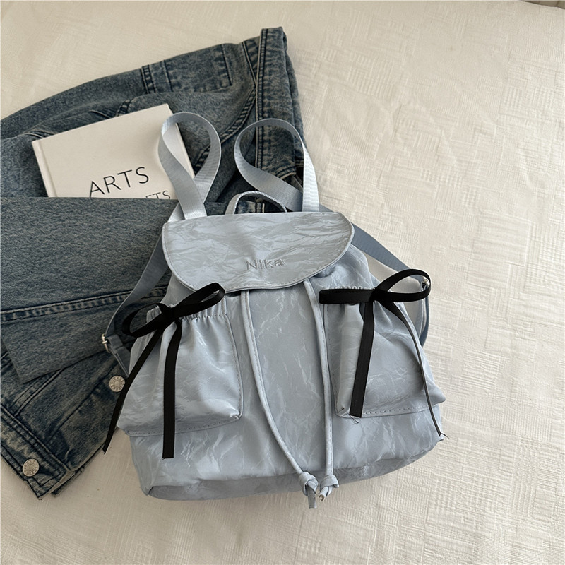 Mochila de lazo de sentido de alta gama para mujer 2025 nueva moda mochila de viaje mochila escolar casual para estudiantes coreanos