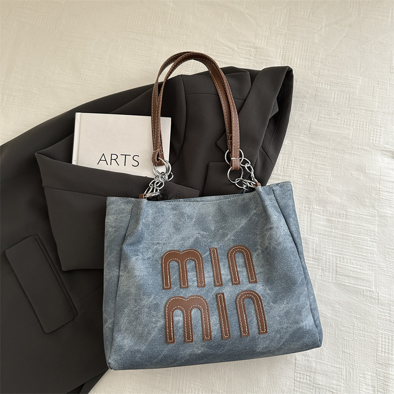 Bolso de otoño de mujer de gran capacidad de transporte 2024 nuevo bolso de hombro de moda nicho de alto nivel bolso de brazo