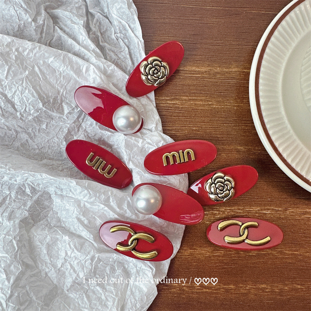 Red elegant fashionable hairgrip with letters