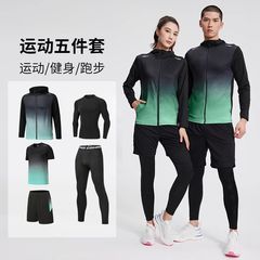 スポーツスーツの男性のフィットネス服のランニング装備の朝のランニング服はトレーニングルームに乗ります。