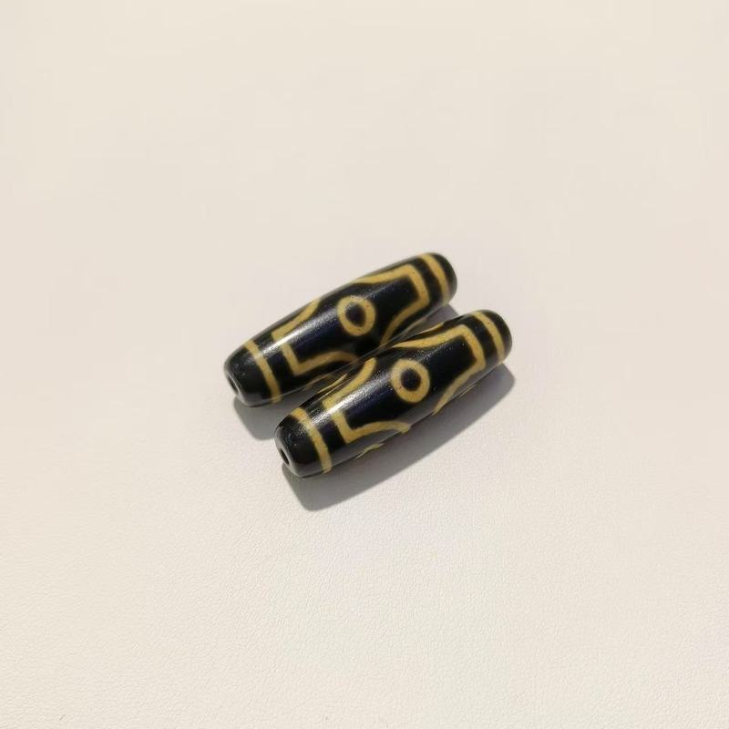 メーカー歯黄包糊九眼12 × 38mm天珠歯黄風化古法包糊瑪瑙天珠【a級】|undefined