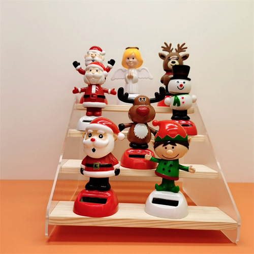 Cross-border Christmas solar-powered automatic swinging doll car shaking head decoration creative car car ornaments