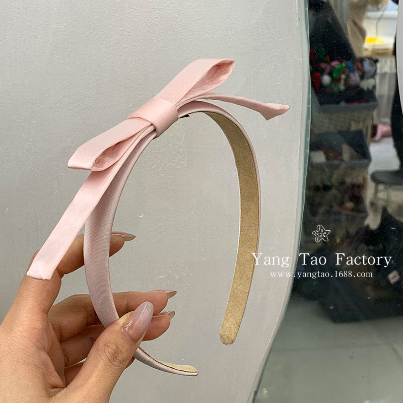 Lazo rosa y aro para el cabello