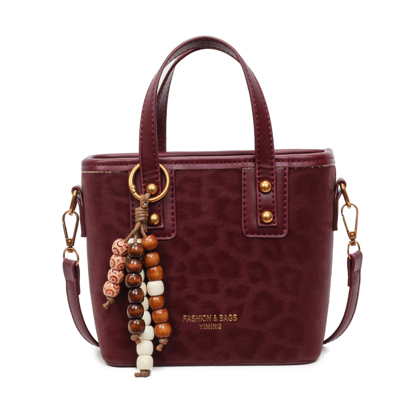 Bolsa de mano con patrón de leopardo transfronterizo, bolsa de cubo de viaje, mujer, otoño y invierno 2025, nueva moda, bolso de hombro de estilo extranjero.