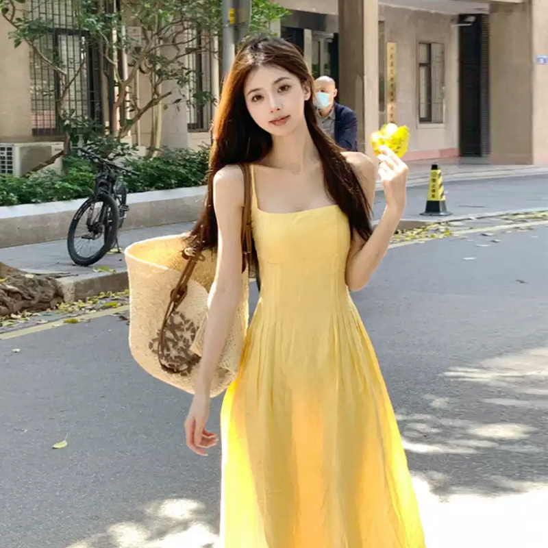 여성을위한 노란색 서스펜더 드레스 2025 새로운 프랑스 여름 하이 엔드 섹시한 백리스 해변 휴가 비치 롱 드레스