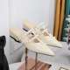 599-10 Korean version shallow mouth hollowed out wedge heel women's shoes white rivet fashion half drag pointed toe middle heel wearing slippers for women