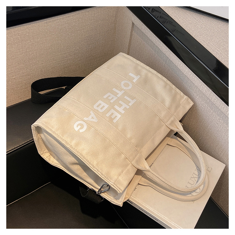 Bolso de mano para mujer, nuevo bolso práctico de lona con nudo transfronterizo, de gran capacidad, adecuado para el trabajo y los desplazamientos, se puede llevar como bolso de hombro o bandolera.