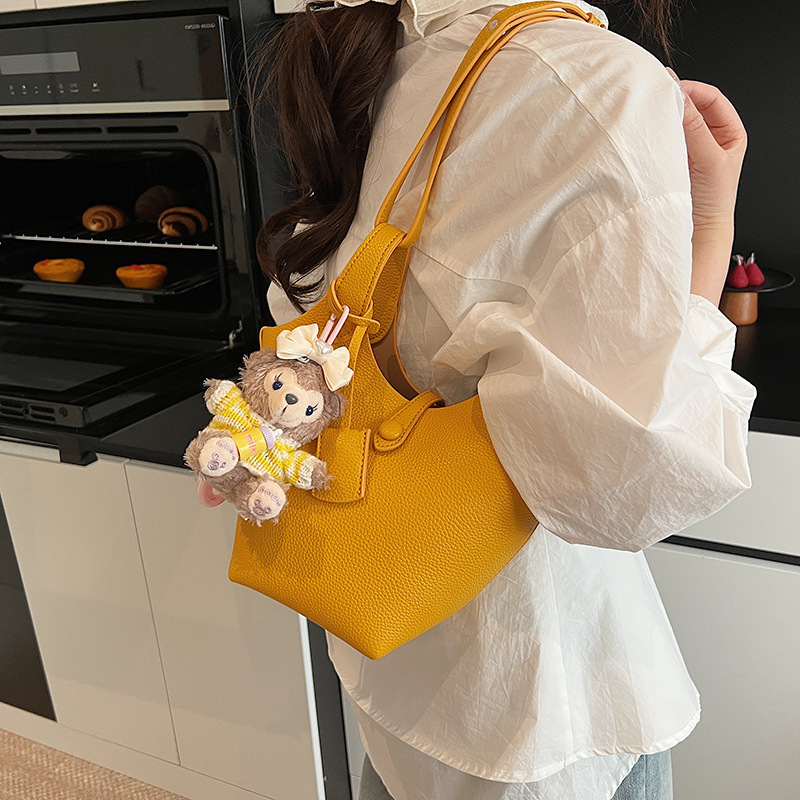 Bolso de cubo de canasta de verduras portátil de gran capacidad de alta calidad para mujer 2025 nuevo bolso de mensajero de hombro de estilo occidental de todo fósforo de moda