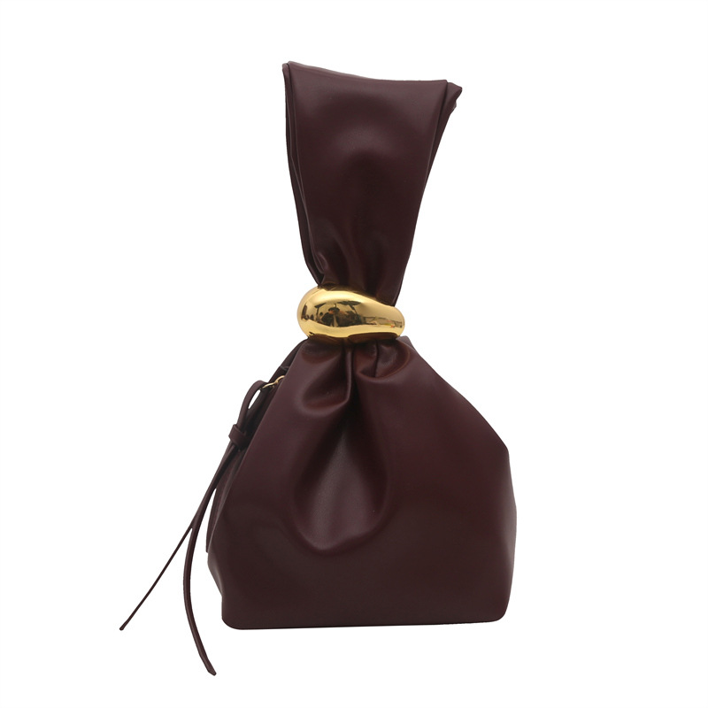 Textura bolso pequeño portátil mujer 2024 otoño e invierno nuevo estilo retro pliegue estilo occidental diseño de nicho bolso de cubo de moda